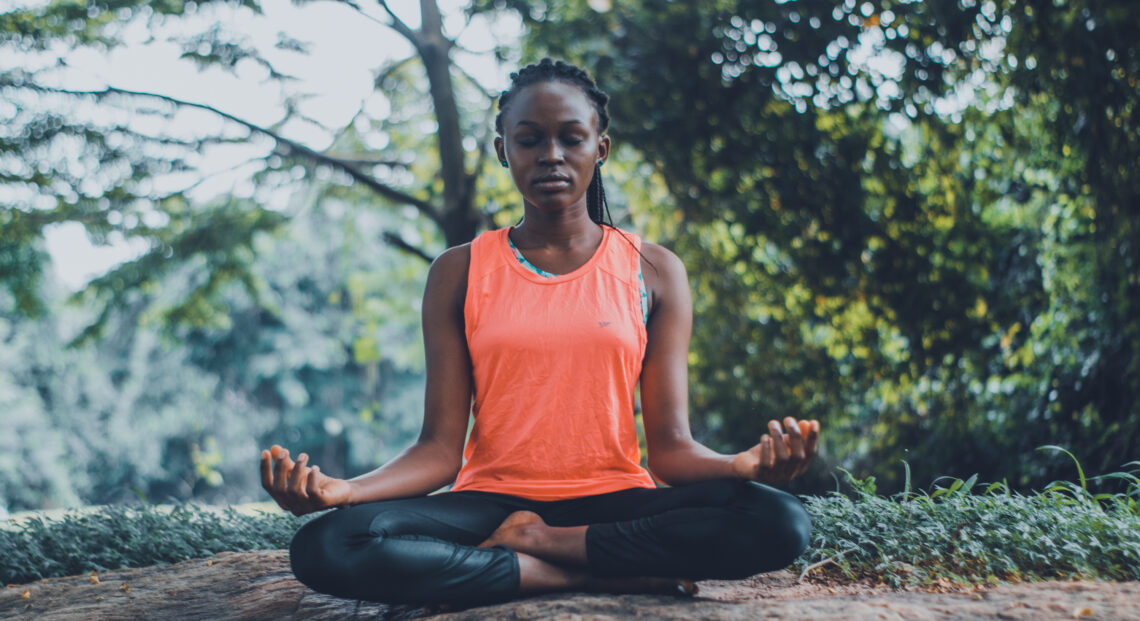 Woman meditating in the outdoors