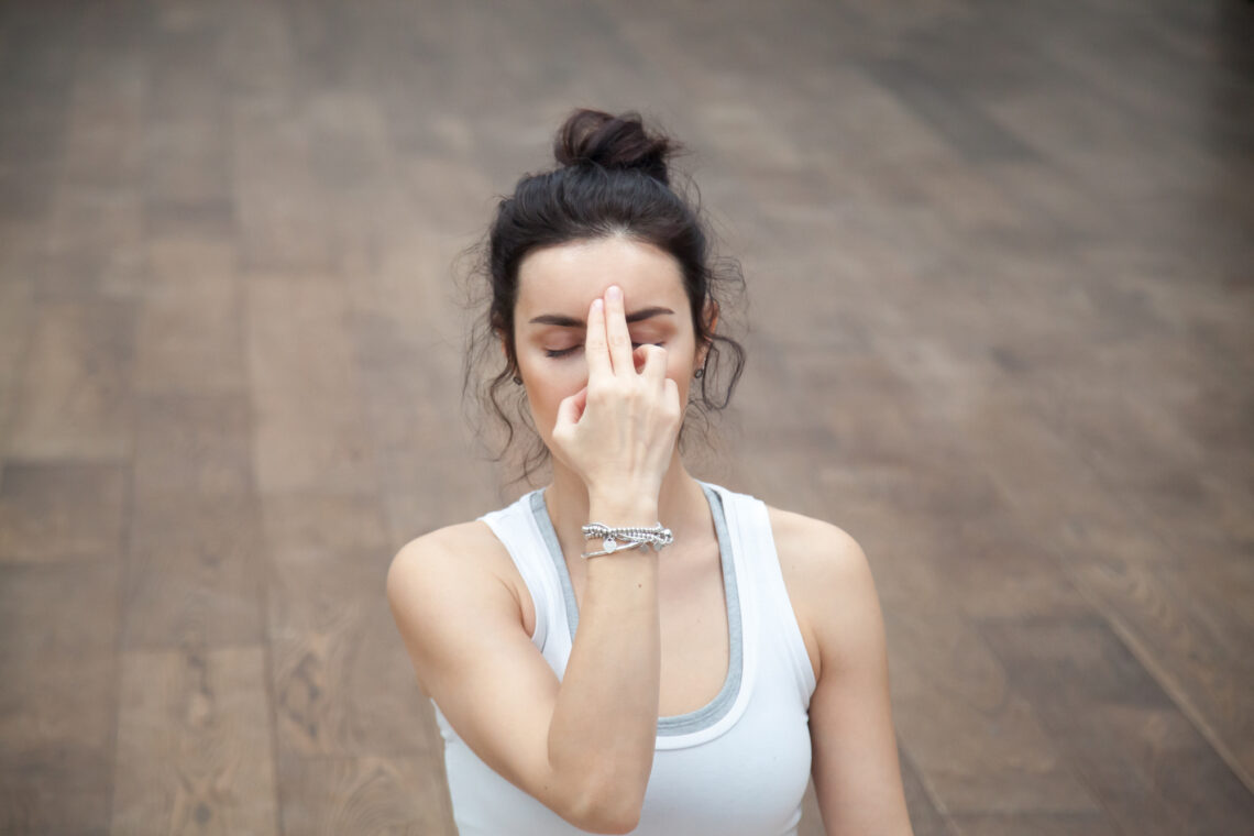 Lady practising alternate nostril breathing