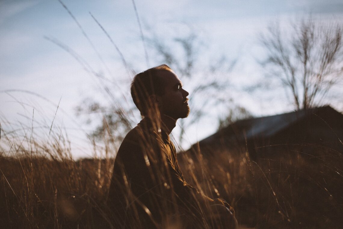 Man sitting outside practising breathwork